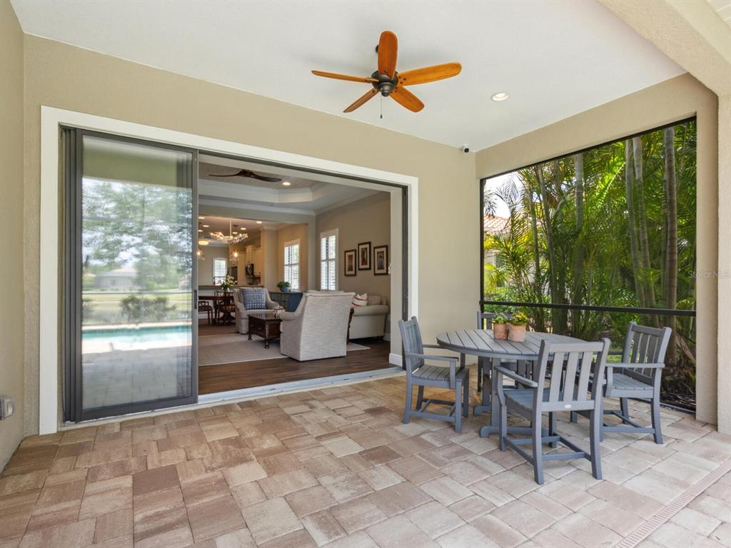 14325 Stirling Drive Lakewood Ranch, FL 34202 - Photo 5 of 53 a view of a livingroom with furniture hardwood floor and a large window