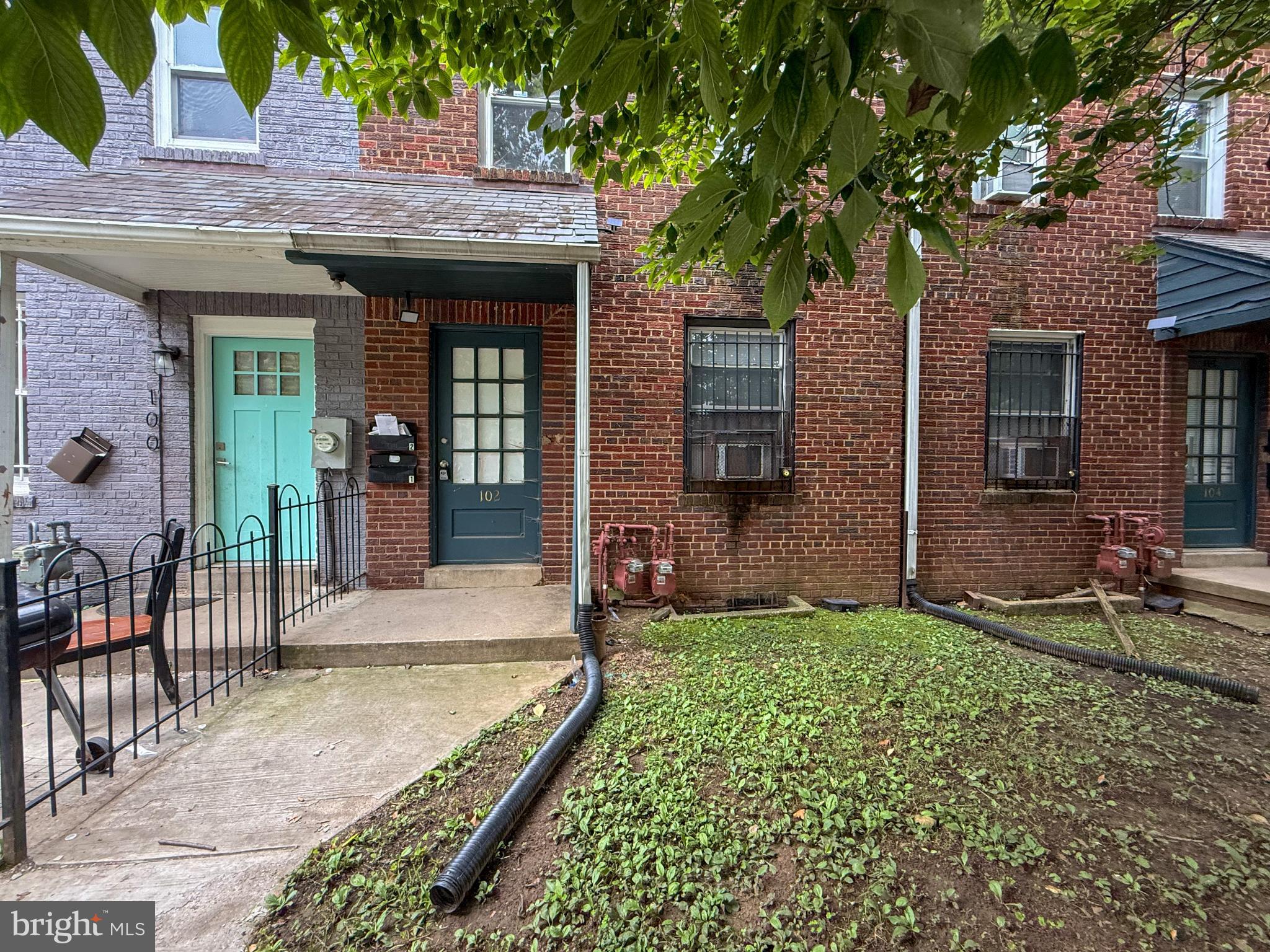 a view of a brick house with a large windows