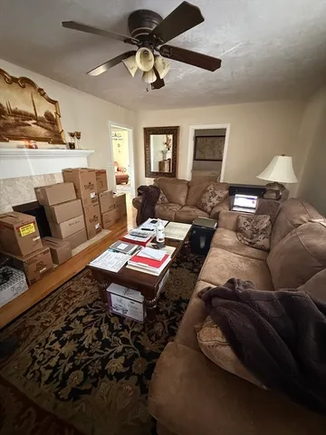 a living room with furniture and a rug