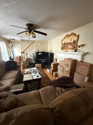 a living room with furniture and a rug