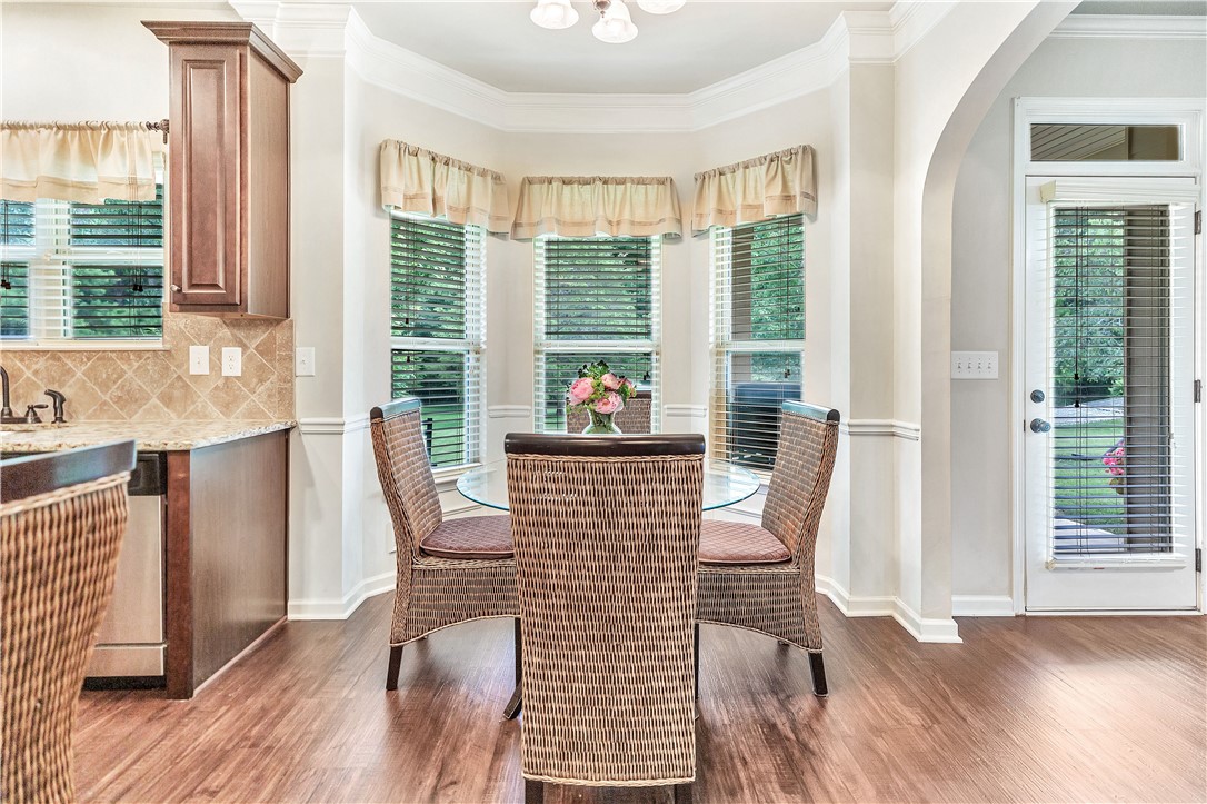 144 Buckland Drive Anderson, SC 29621 - Photo 33 of 48 A well-lit breakfast nook with a bay window and hardwood floors, perfect for casual dining.
