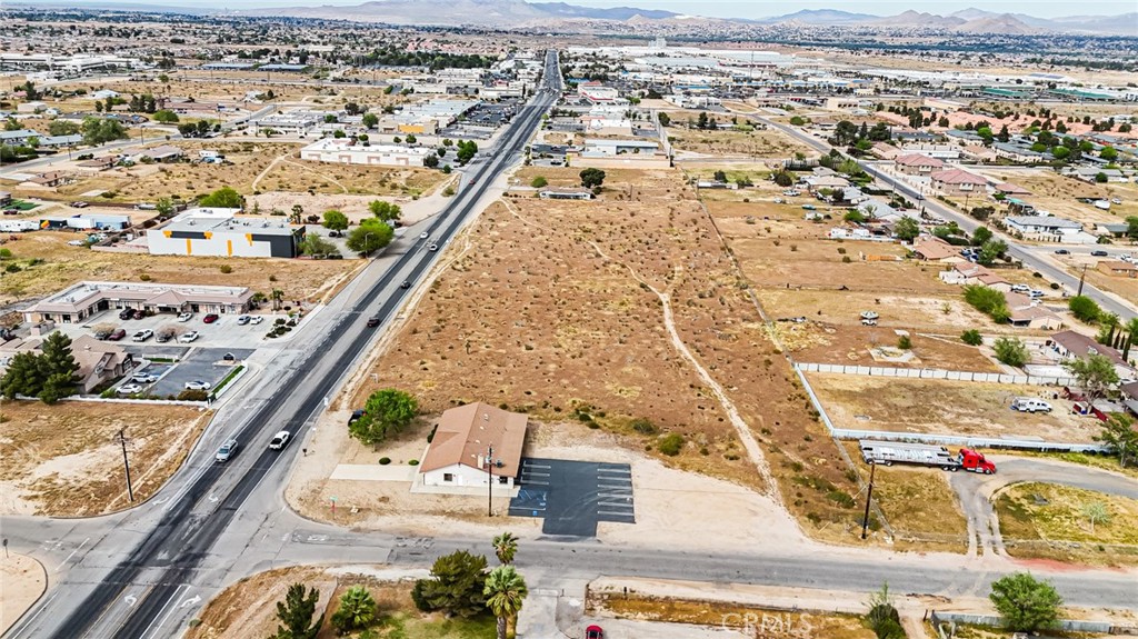 11695 Hesperia Road Hesperia, CA 92345 - Photo 13 of 31 an aerial view of residential houses with outdoor space