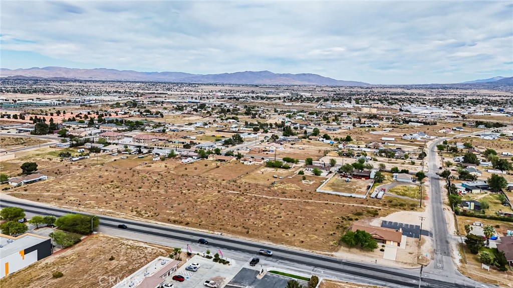 11695 Hesperia Road Hesperia, CA 92345 - Photo 15 of 31 an aerial view of residential houses with outdoor space