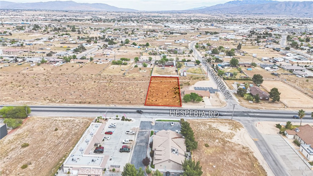 11695 Hesperia Road Hesperia, CA 92345 - Photo 16 of 31 an aerial view of residential houses with outdoor space