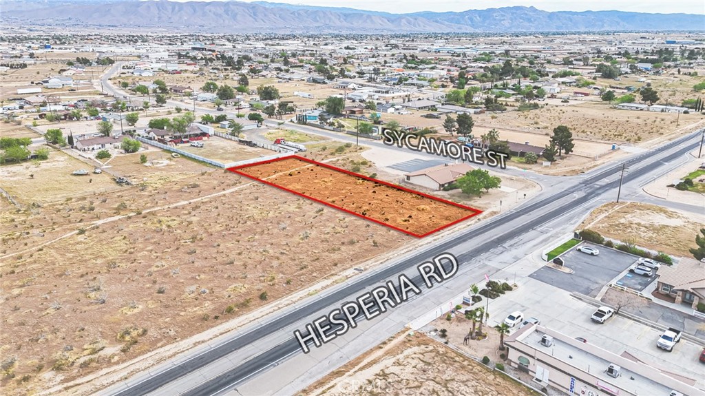 11695 Hesperia Road Hesperia, CA 92345 - Photo 19 of 31 an aerial view of residential houses with outdoor space