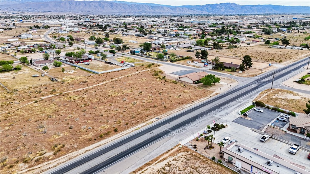 11695 Hesperia Road Hesperia, CA 92345 - Photo 20 of 31 an aerial view of residential houses with outdoor space