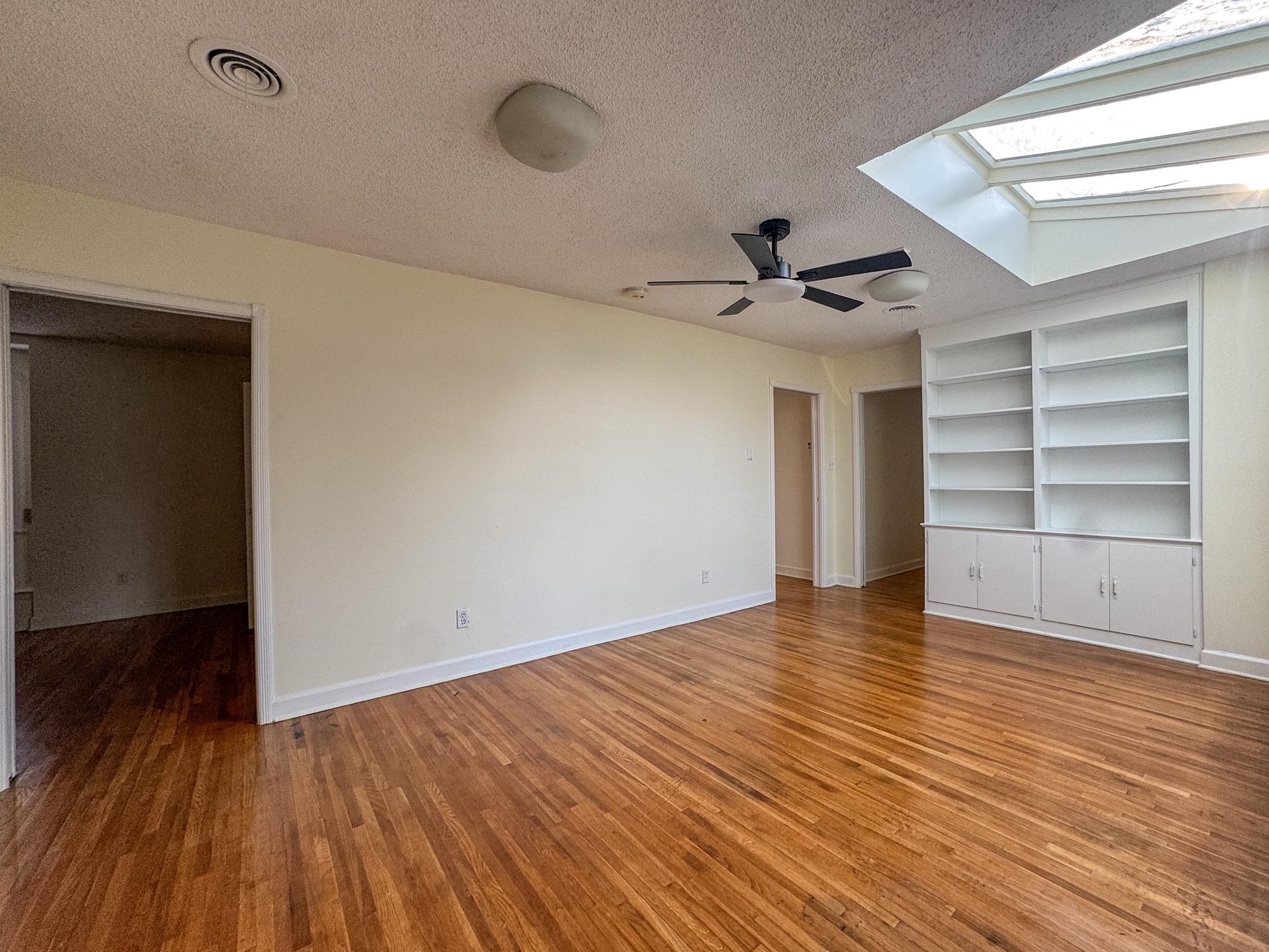 1345 Hickory Ridge Cove Memphis, TN 38116 - Photo 14 of 29 wooden floor in an empty room with a window