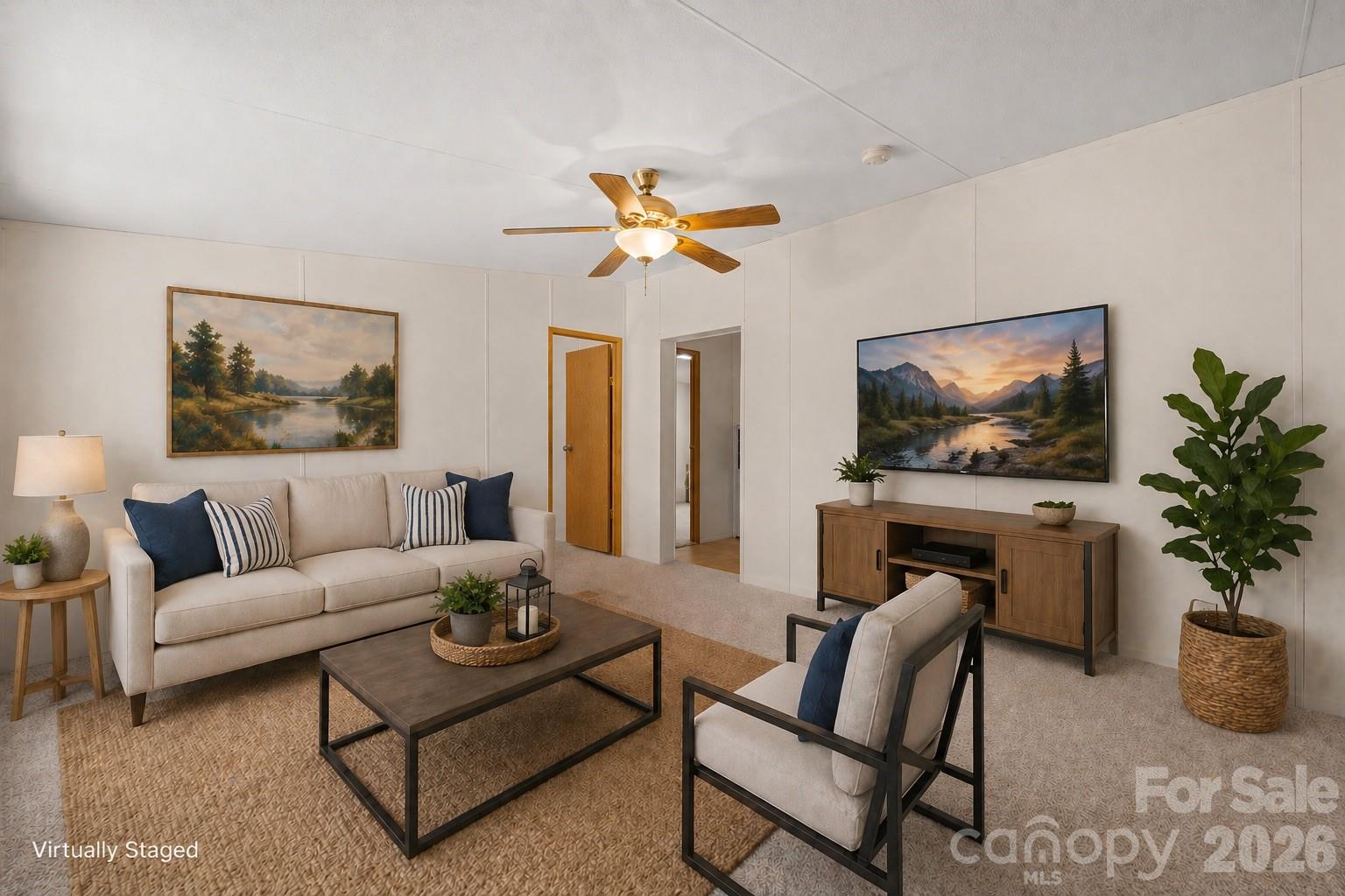 3536 Nelson Lane Morganton, NC 28655 - Photo 12 of 33 a living room with furniture a flat screen tv and a potted plant