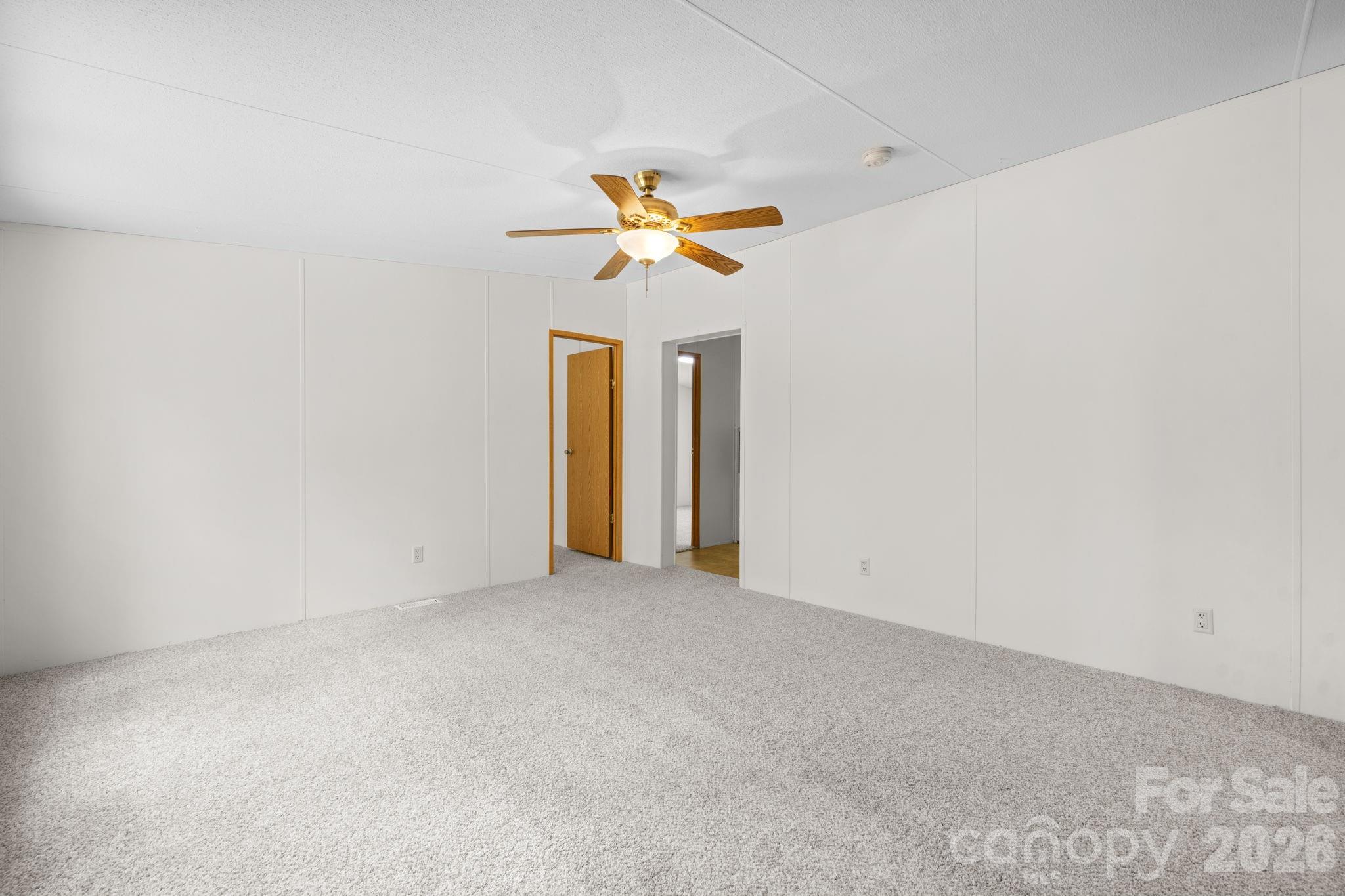3536 Nelson Lane Morganton, NC 28655 - Photo 13 of 33 an empty room with a window and a ceiling fan