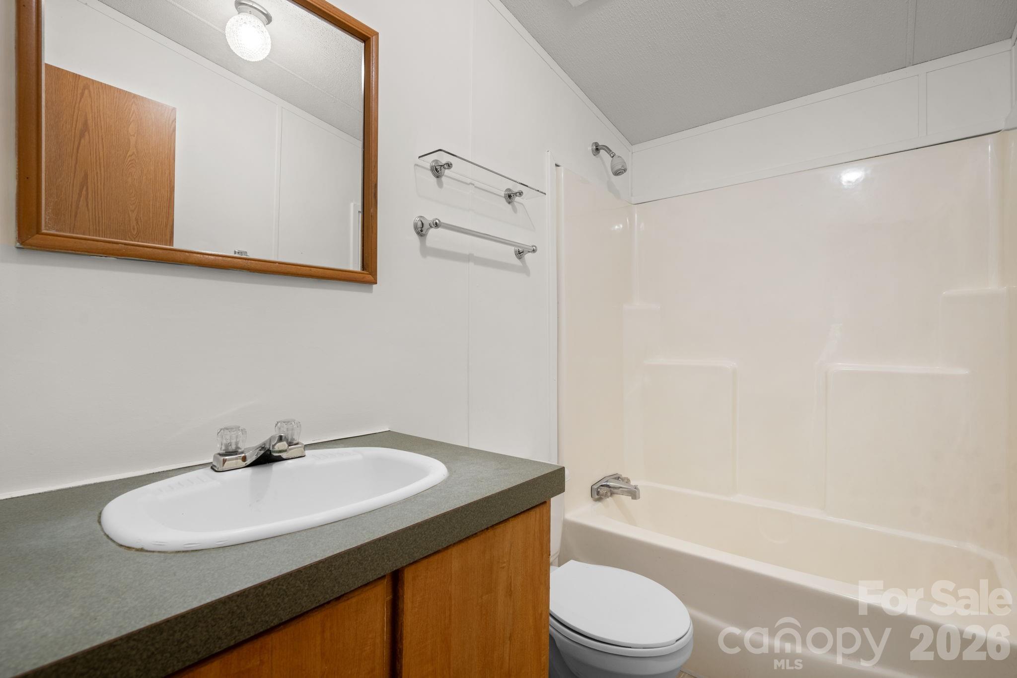 3536 Nelson Lane Morganton, NC 28655 - Photo 15 of 33 a bathroom with a granite countertop sink toilet and shower