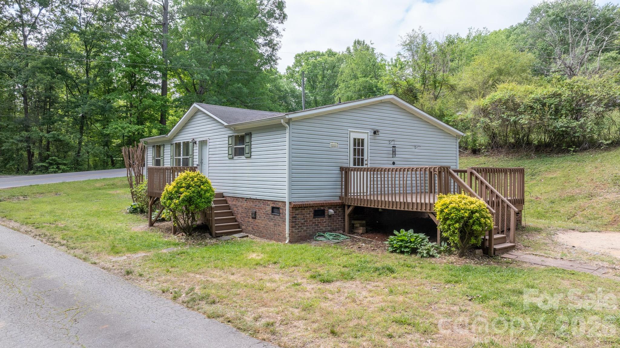 3536 Nelson Lane Morganton, NC 28655 - Photo 2 of 33 a view of a house with a yard and sitting area