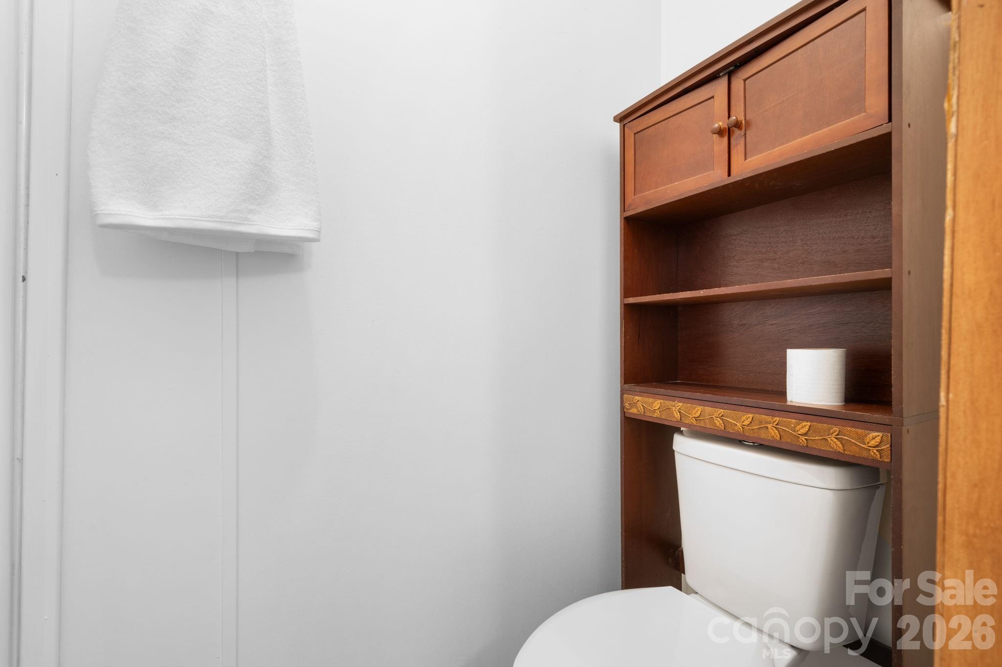 3536 Nelson Lane Morganton, NC 28655 - Photo 22 of 33 a bathroom with a toilet a sink and mirror