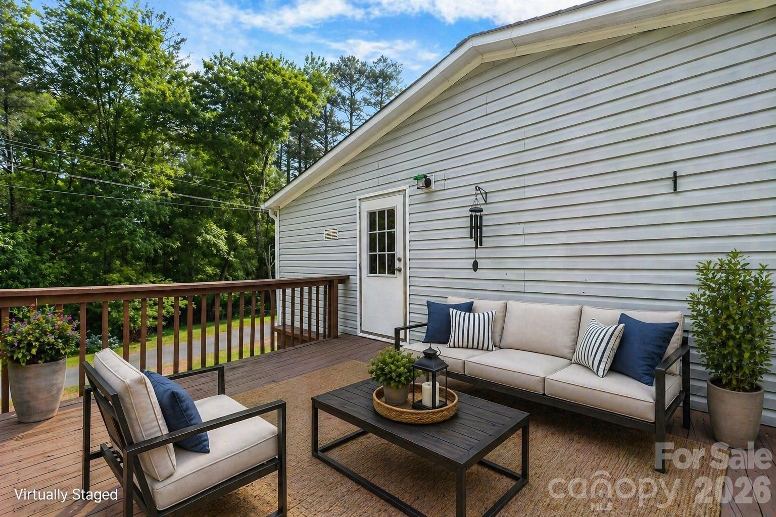 3536 Nelson Lane Morganton, NC 28655 - Photo 29 of 33 a view of a patio with couches and a potted plant on a table