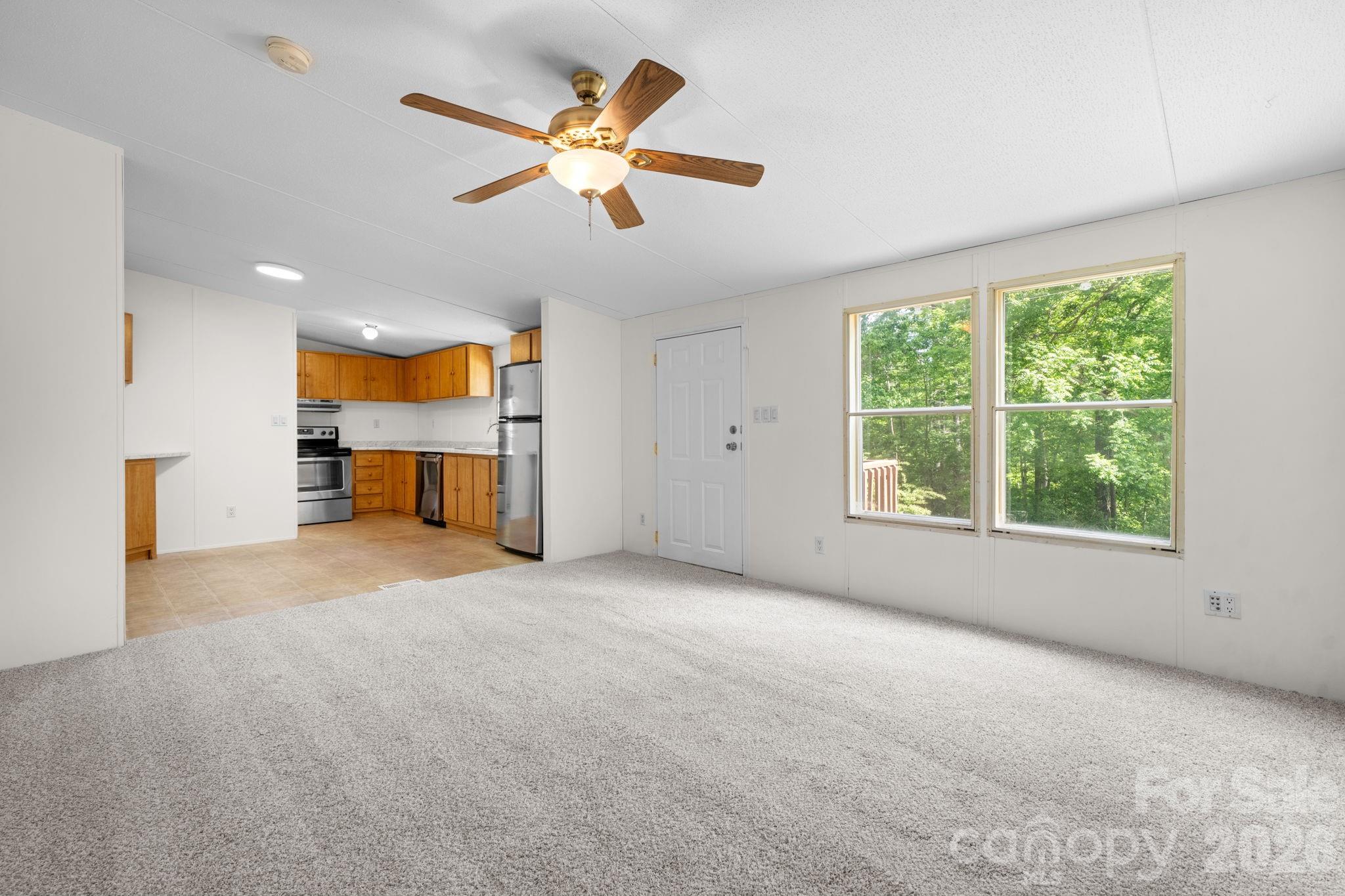 3536 Nelson Lane Morganton, NC 28655 - Photo 7 of 33 a view of a livingroom with a ceiling fan and a window