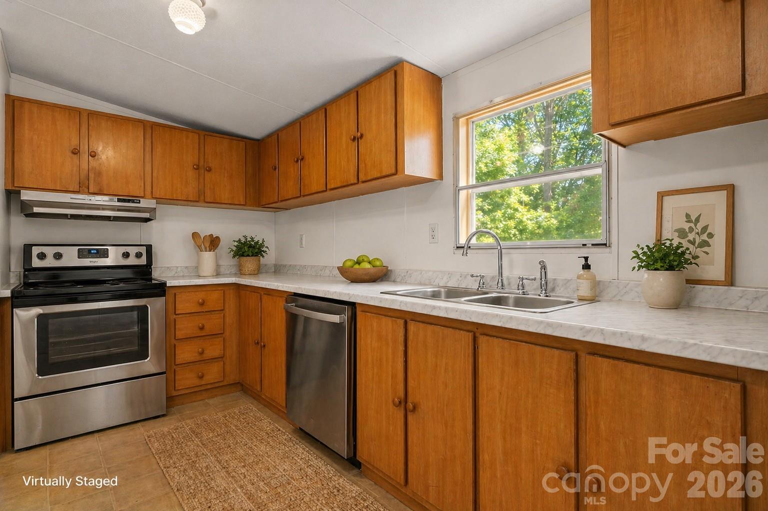 3536 Nelson Lane Morganton, NC 28655 - Photo 10 of 33 a kitchen with stainless steel appliances granite countertop a sink a stove and a microwave