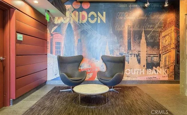 a view of a room with furniture and wooden floor