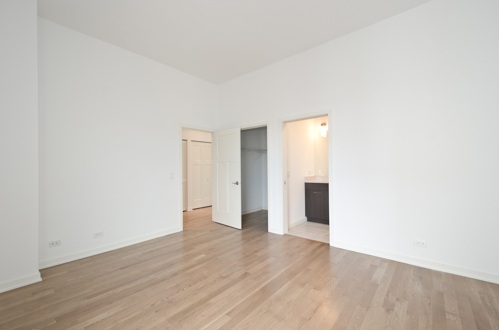 Undisclosed Address Chicago, IL 60642 - Photo 13 of 14 a view of a big room with wooden floor and windows