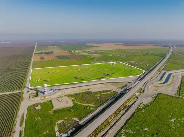 a view of a pool with a sitting area