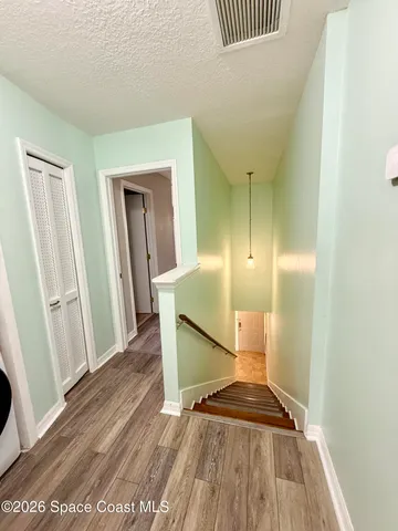 a view of a hallway with washer and dryer