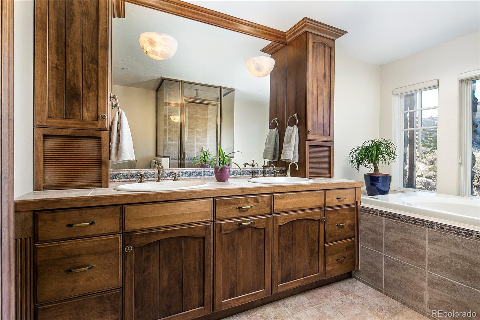 355 Mountain King Road Boulder, CO 80302 - Photo 16 of 33 a bathroom with a double vanity sink and a mirror