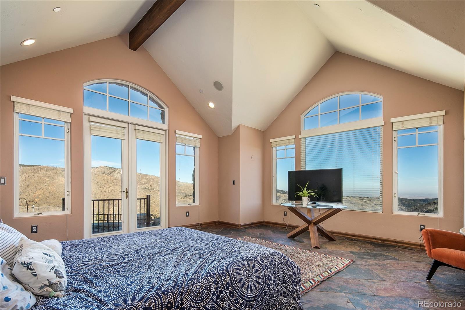 355 Mountain King Road Boulder, CO 80302 - Photo 18 of 33 a bedroom with a bed and large window