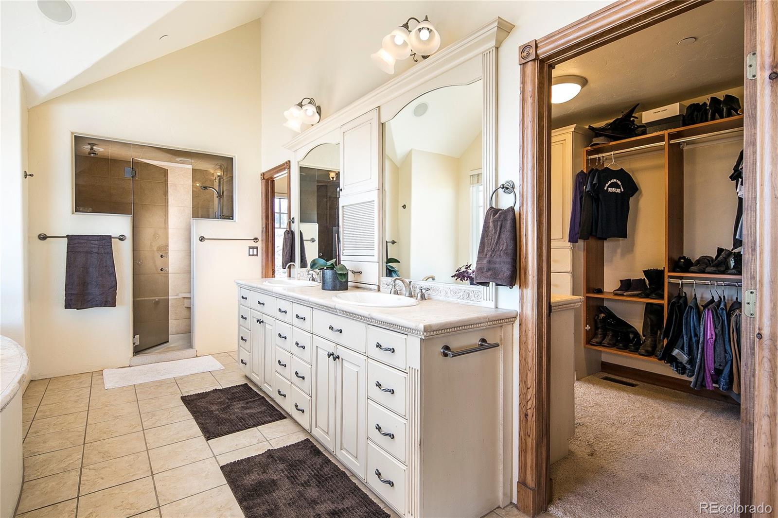 355 Mountain King Road Boulder, CO 80302 - Photo 20 of 33 a spacious bathroom with a double vanity sink and a mirror
