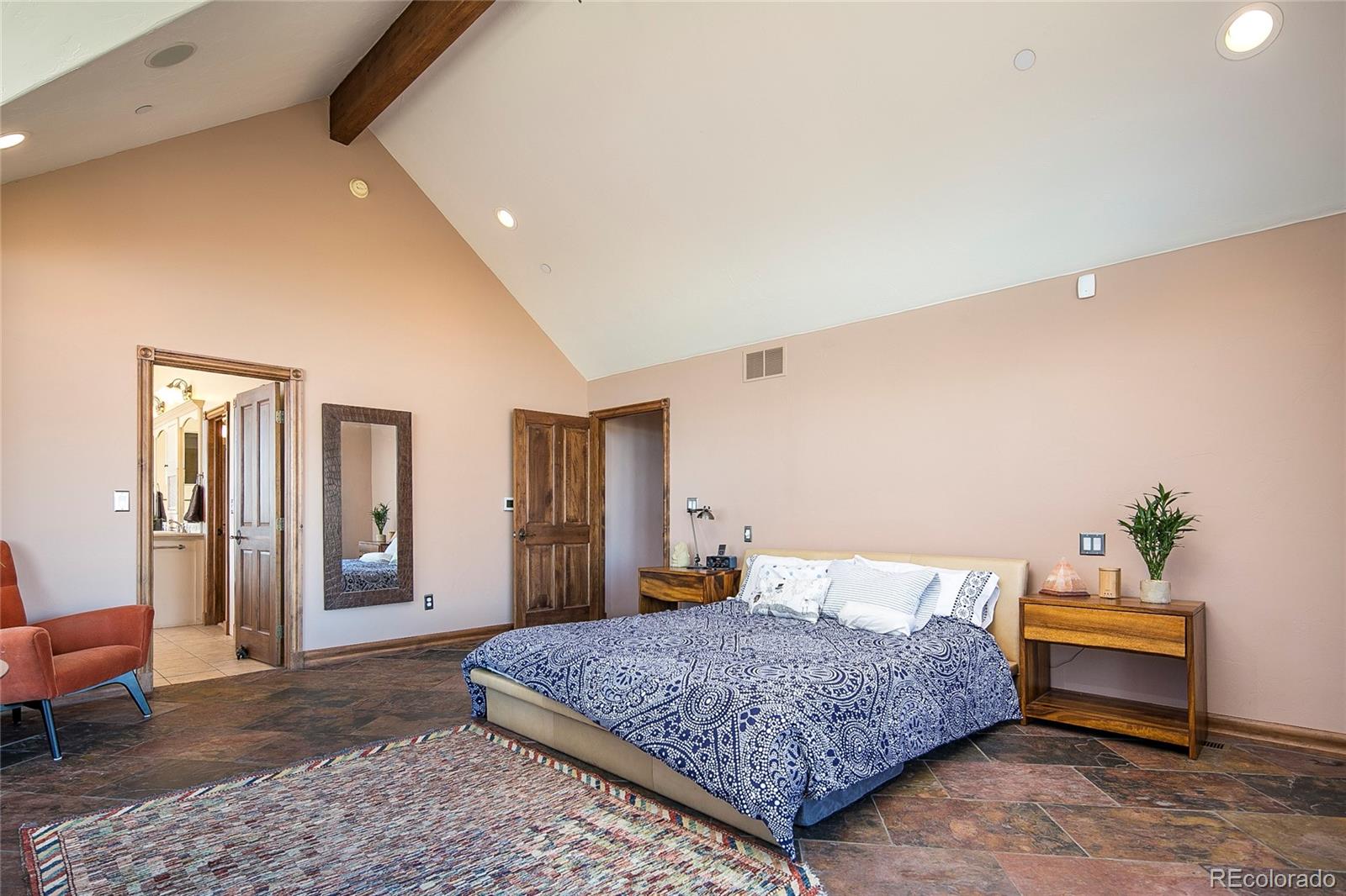 355 Mountain King Road Boulder, CO 80302 - Photo 21 of 33 a bedroom with a bed a table and chair