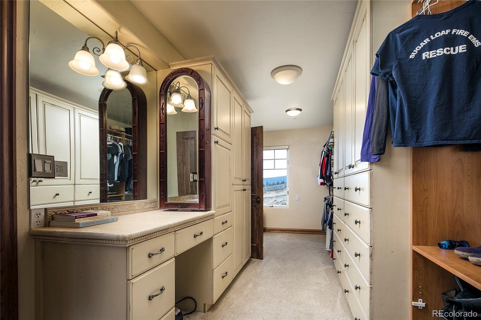 355 Mountain King Road Boulder, CO 80302 - Photo 22 of 33 a bathroom with a double vanity sink and a mirror