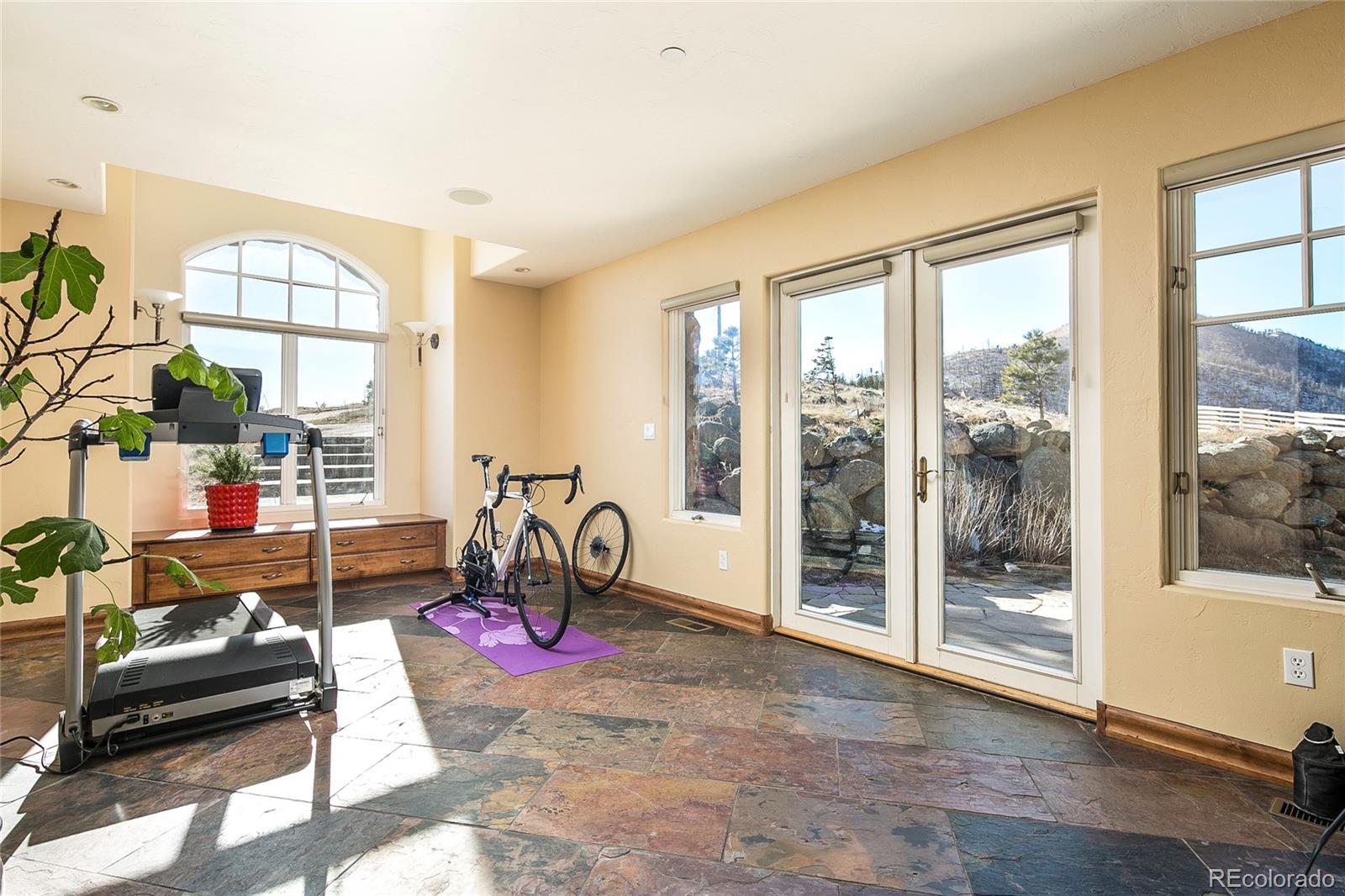 355 Mountain King Road Boulder, CO 80302 - Photo 23 of 33 a living room with furniture and a floor to ceiling window