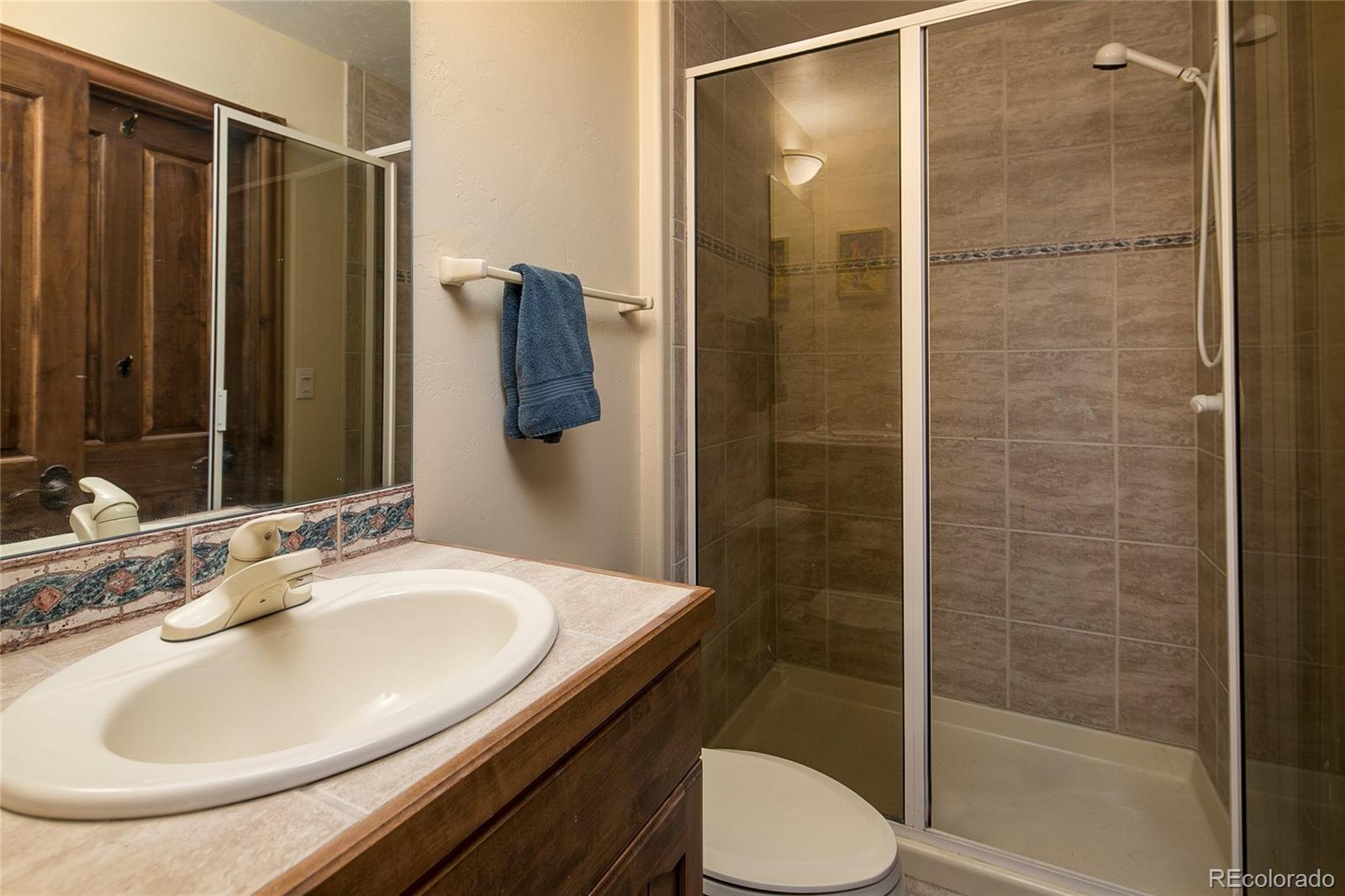 355 Mountain King Road Boulder, CO 80302 - Photo 27 of 33 a bathroom with a sink toilet and shower
