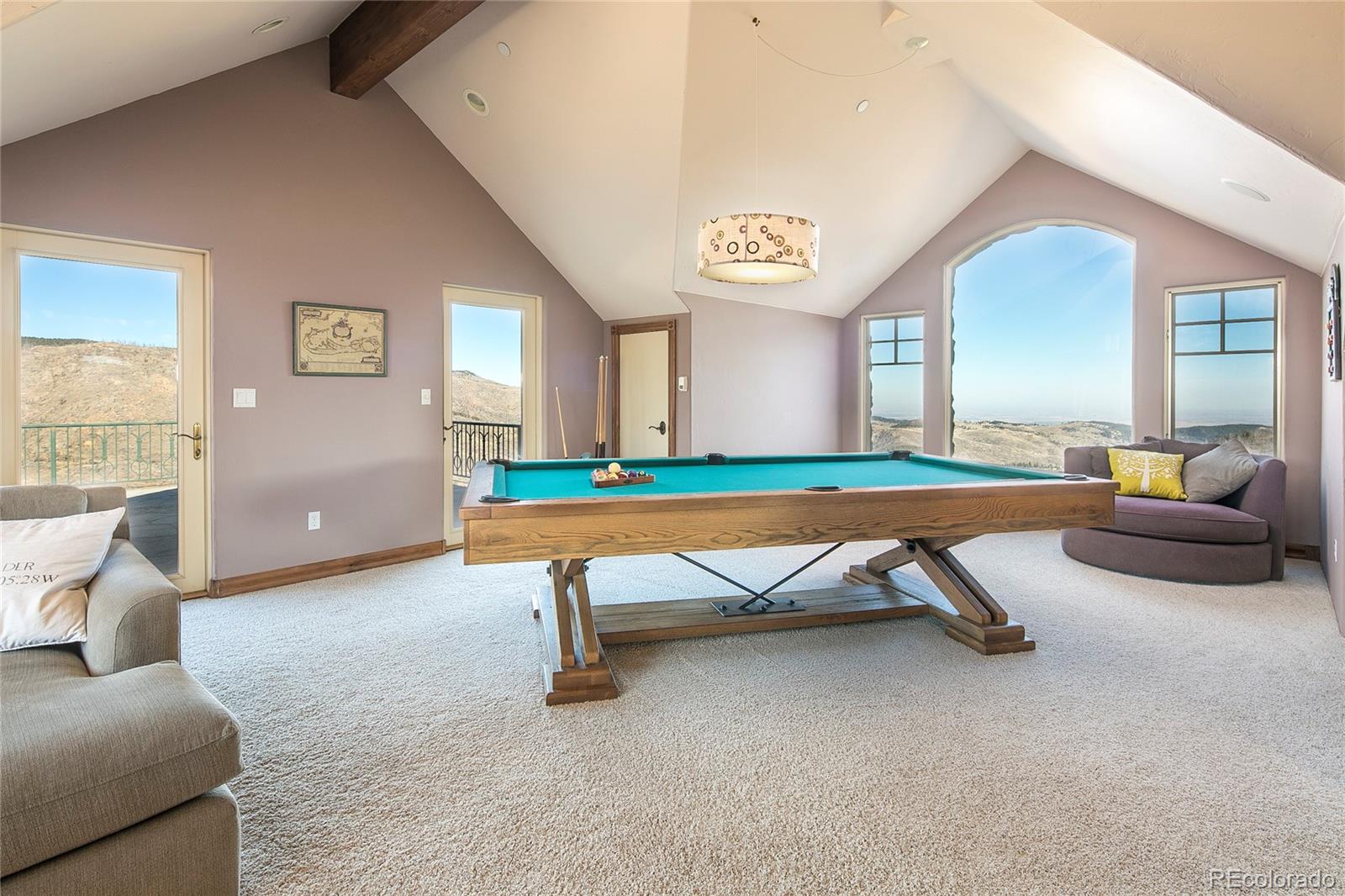 355 Mountain King Road Boulder, CO 80302 - Photo 29 of 33 a bedroom with furniture and a wooden floor