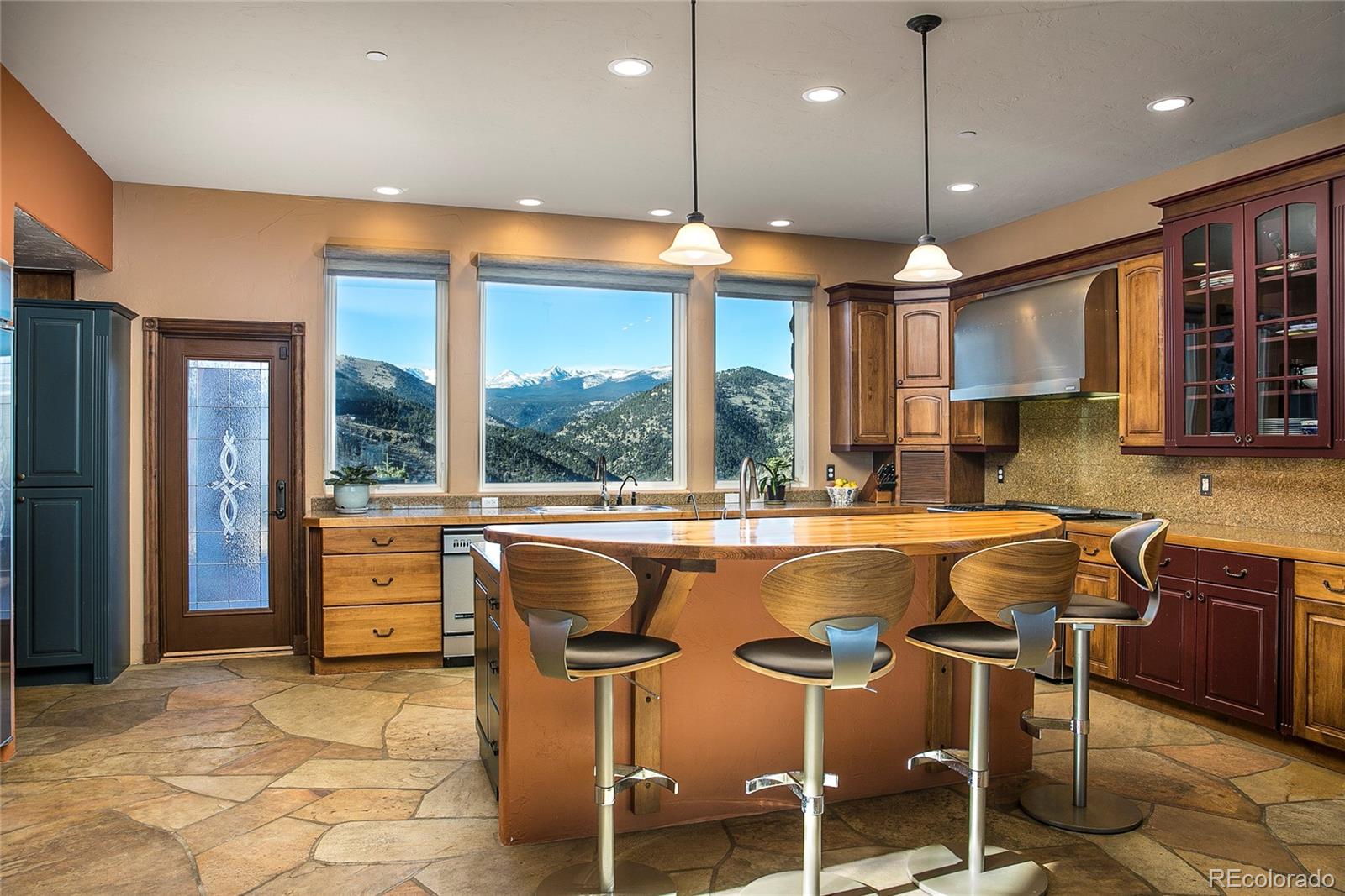 355 Mountain King Road Boulder, CO 80302 - Photo 8 of 33 a dining table with chairs and window