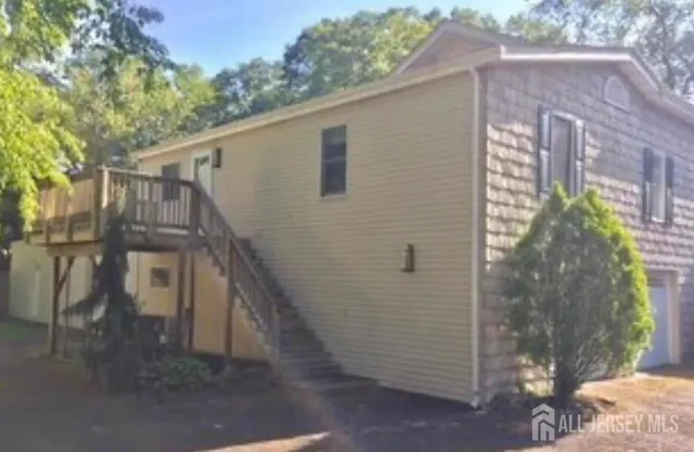 a view of a house with a tree