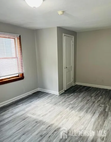 a view of backyard with trampoline