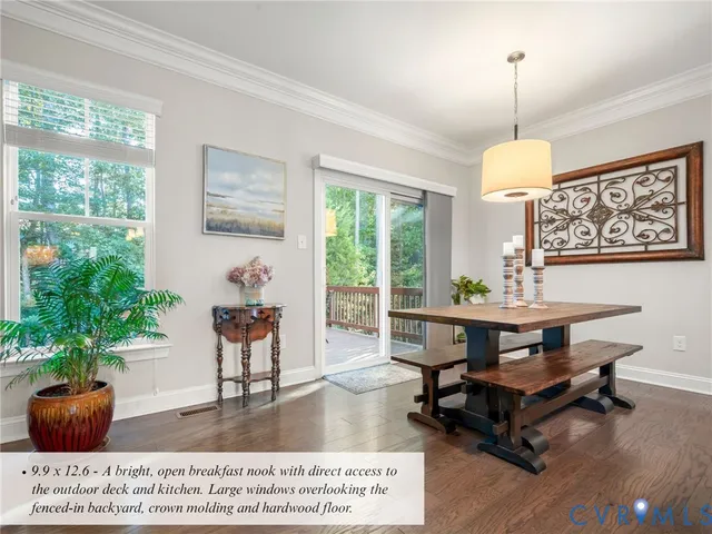 a kitchen with stainless steel appliances kitchen island granite countertop a stove a sink a refrigerator and white cabinets