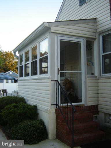 161 Meadow Road Pasadena, MD 21122 - Photo 3 of 21 Glass enclosed side porch