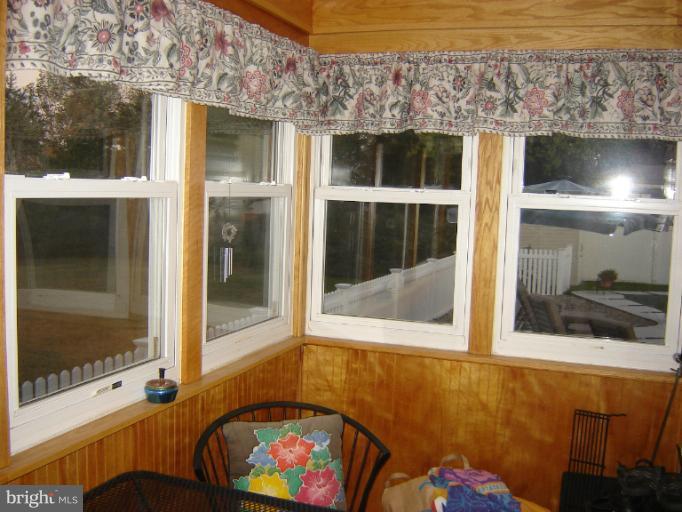 161 Meadow Road Pasadena, MD 21122 - Photo 8 of 21 glass enclosed side porch inside view