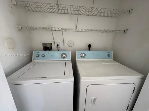 a utility room with dryer and washer