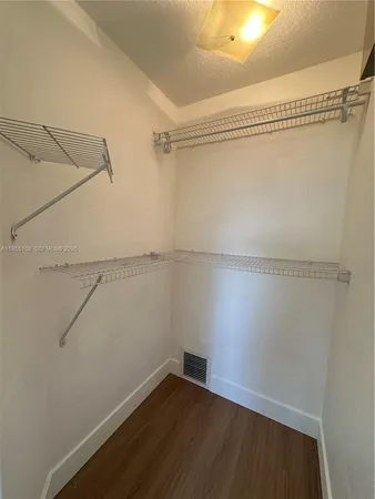 a view of a room with racks on the wall