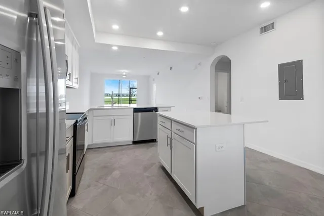 a front view of a building with a garden