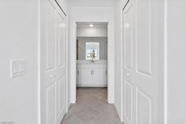 a living room with lots of furniture and clutter