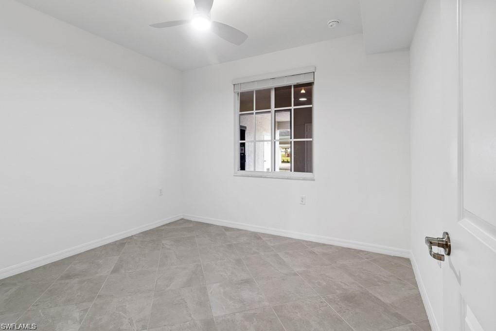 5651 Double Eagle Circle, Unit 4314 Immokalee, FL 34142 - Photo 12 of 41 Spare room with baseboards and a ceiling fan
