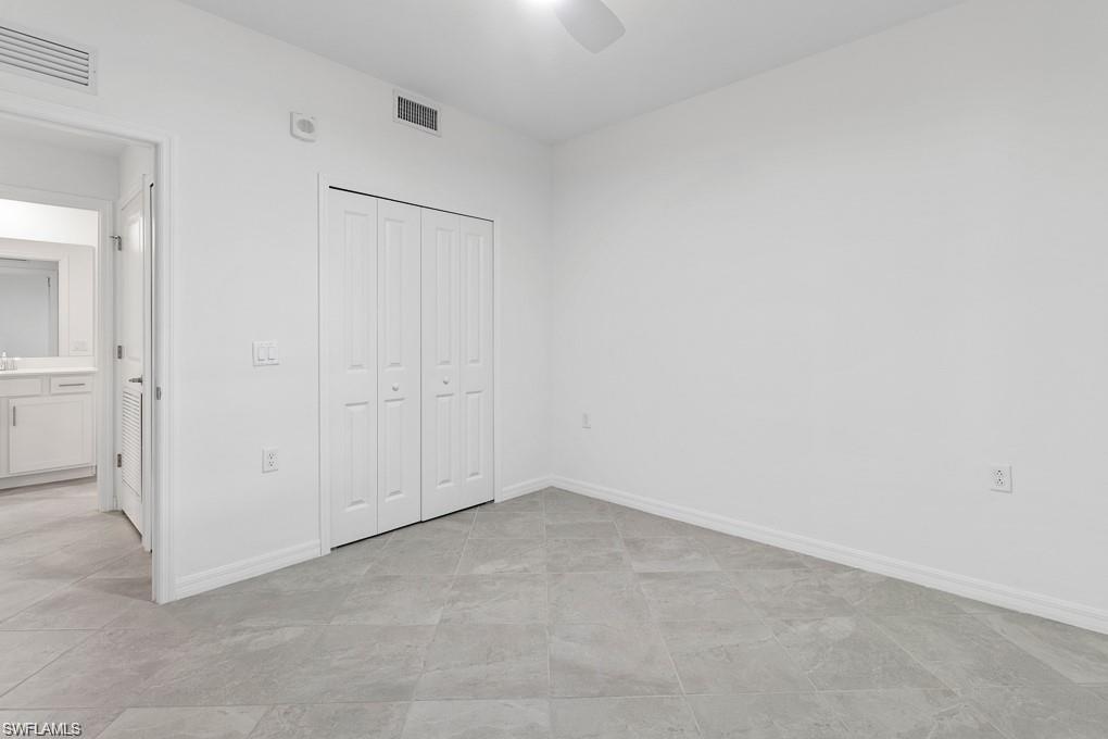 5651 Double Eagle Circle, Unit 4314 Immokalee, FL 34142 - Photo 13 of 41 Unfurnished bedroom featuring a closet and ceiling fan