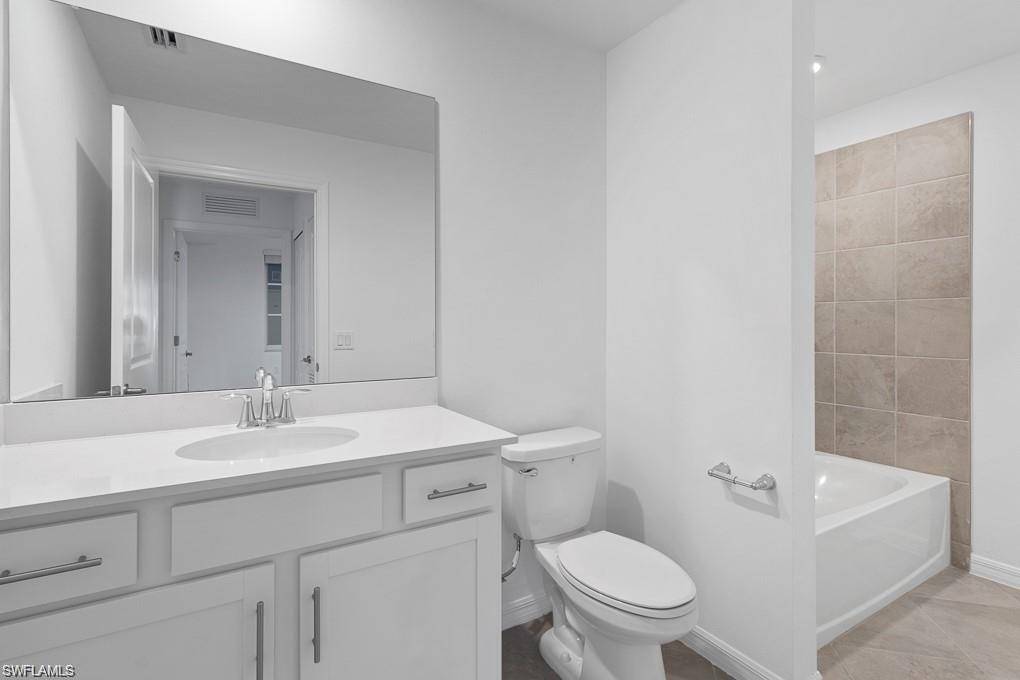 5651 Double Eagle Circle, Unit 4314 Immokalee, FL 34142 - Photo 14 of 41 Bathroom with vanity and toilet