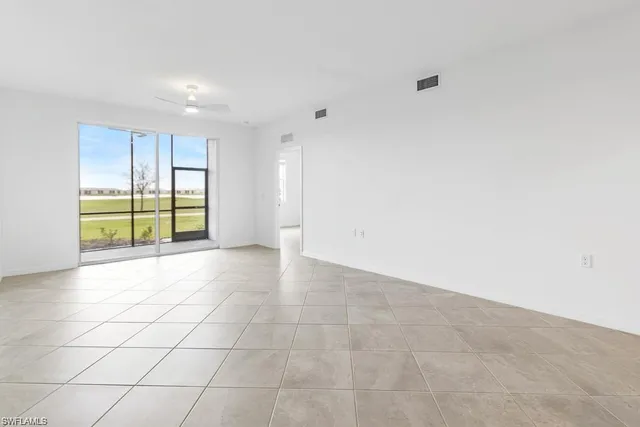 a view of kitchen with dining table and chairs
