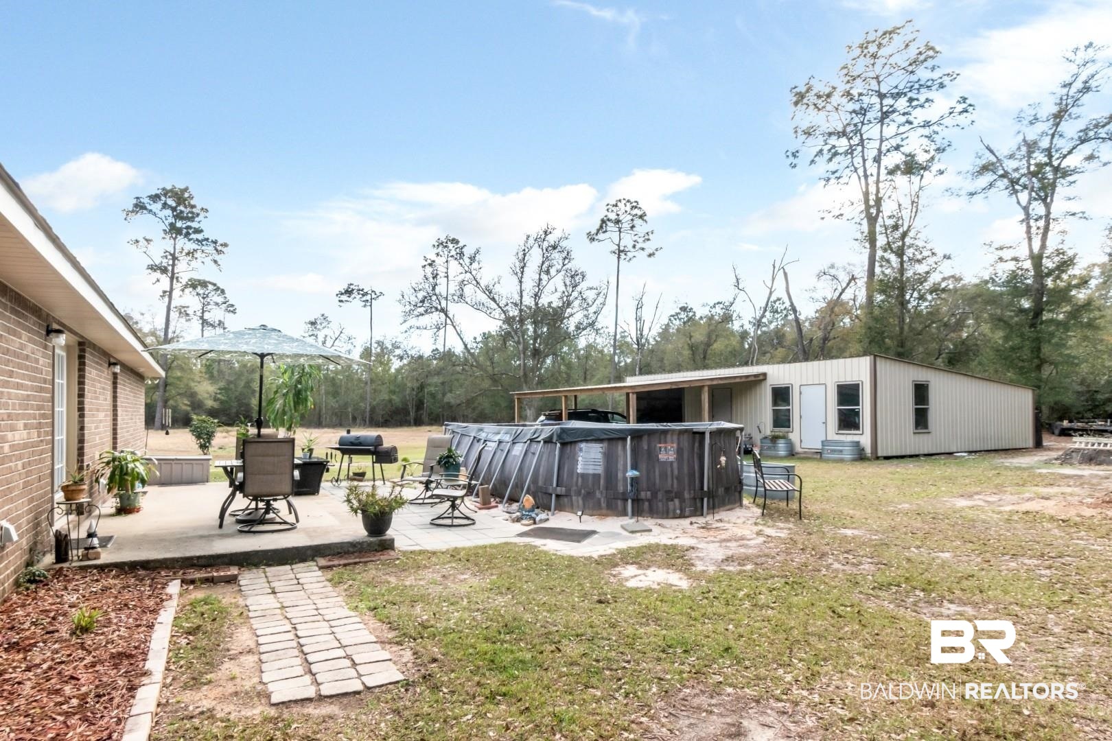 11528 Mocking Bird Lane Fairhope, AL 36532 - Photo 31 of 45 View of green lawn featuring a patio area and an outdoor pool