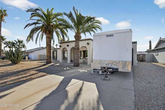a view of multiple house with swimming pool and sitting area