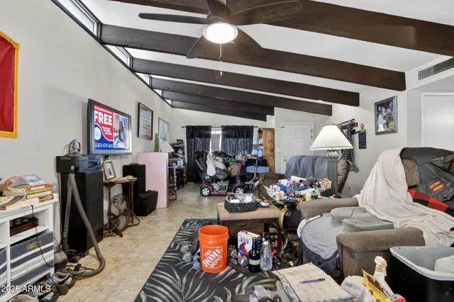 a view of a livingroom with furniture and a window