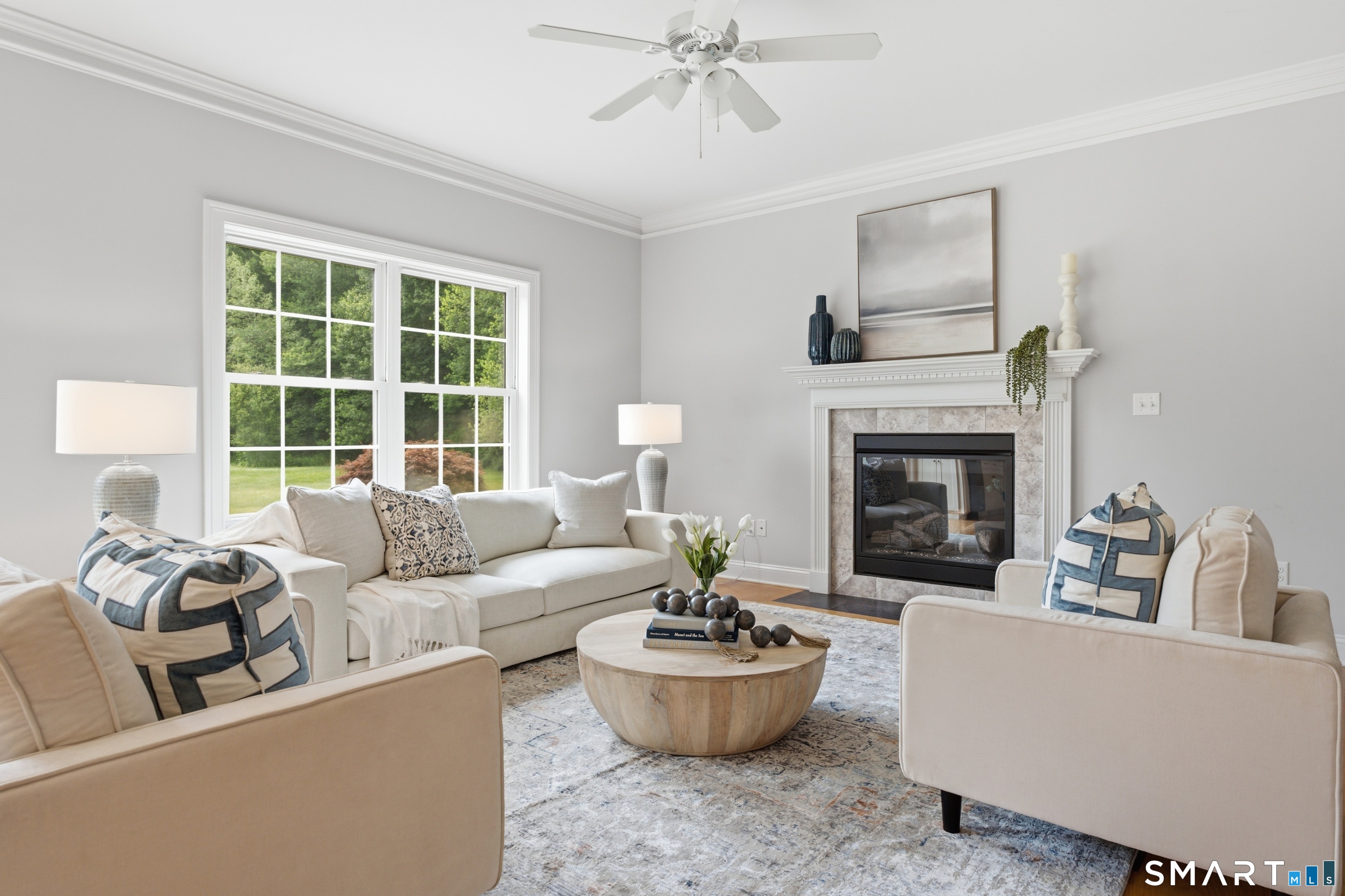838 Little Meadow Road Guilford, CT 06437 - Photo 8 of 40 The main level features high ceilings, beautiful crown molding and in the family room a propane fireplace to warm things up and add charm with just a flick of a switch!