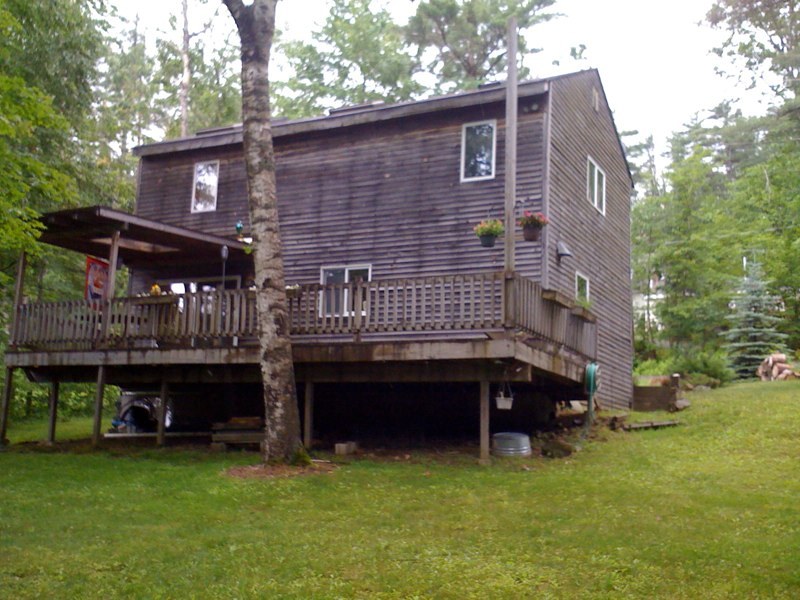 143-151 Rainbow Road Otis, MA 01029 - Photo 1 of 18 a view of house with a yard
